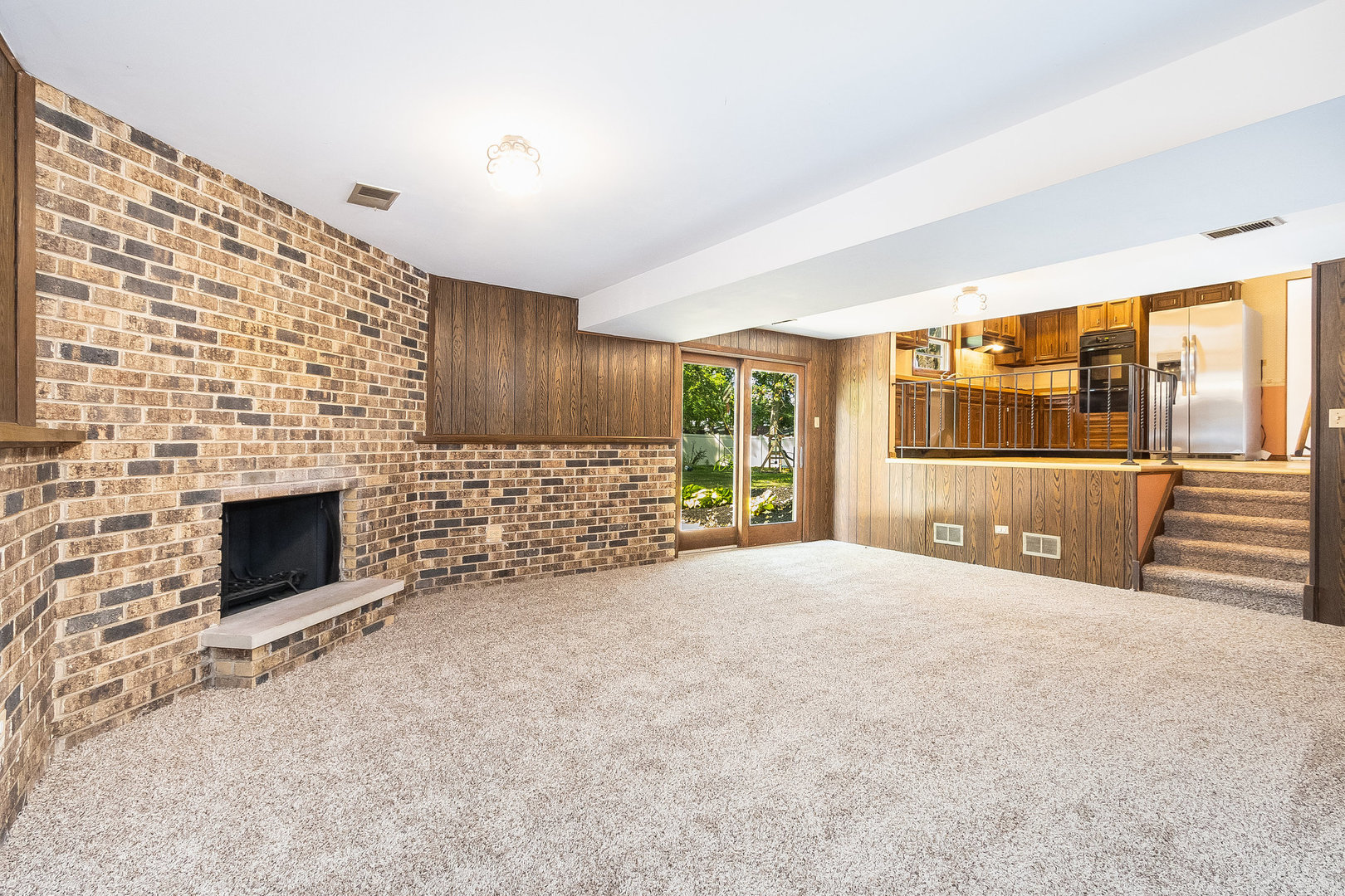 17010 Gaynelle Road Tinley Park, IL 60477 - Photo 6 of 19 a view of an empty room with a fireplace and a window