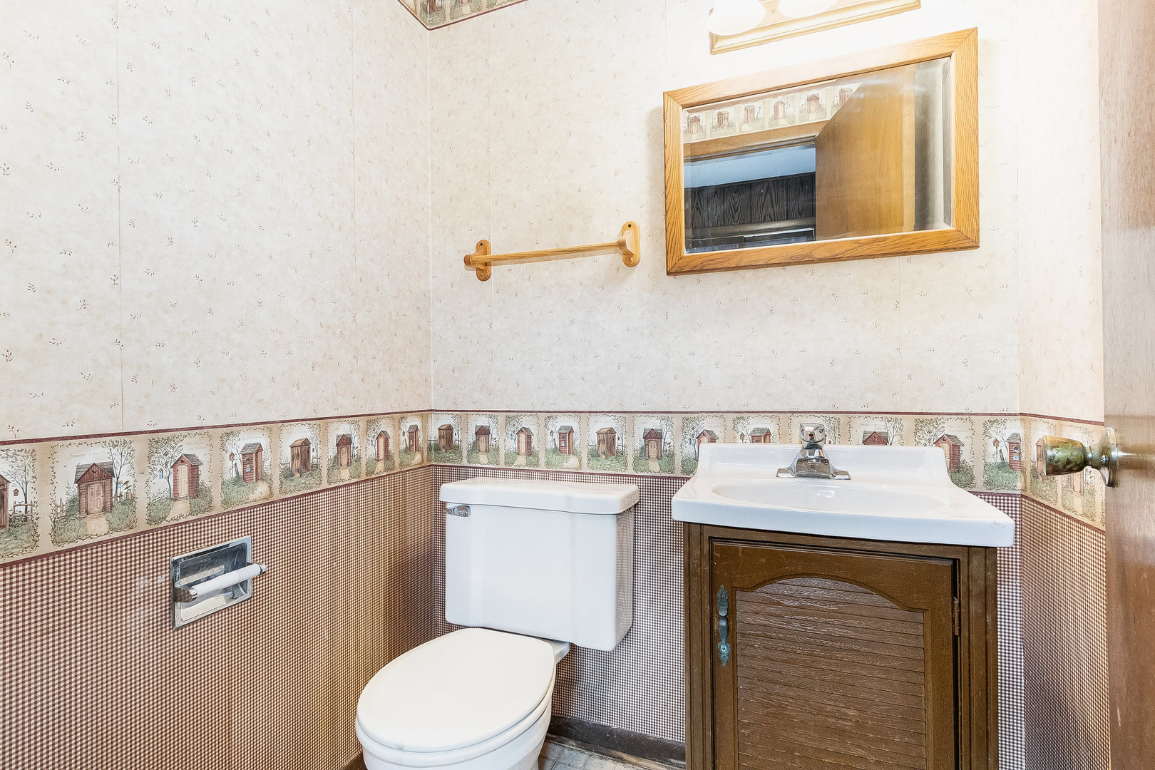 17010 Gaynelle Road Tinley Park, IL 60477 - Photo 7 of 19 a bathroom with a sink a toilet and mirror