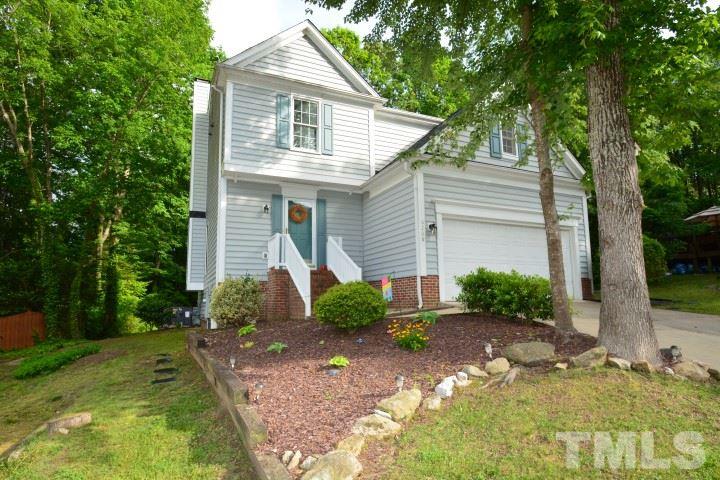 6208 Brielson Place Raleigh, NC 27616 - Photo 1 of 18 a front view of a house with garden