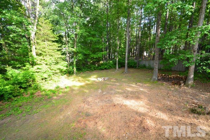 6208 Brielson Place Raleigh, NC 27616 - Photo 17 of 18 a view of a yard with a tree