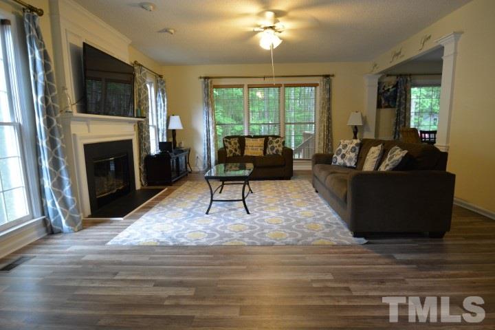6208 Brielson Place Raleigh, NC 27616 - Photo 4 of 18 a living room with furniture and a fireplace