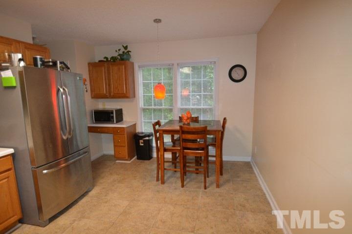 6208 Brielson Place Raleigh, NC 27616 - Photo 7 of 18 a view of kitchen with furniture and refrigerator