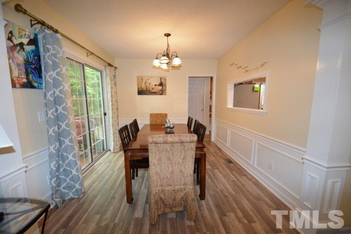 6208 Brielson Place Raleigh, NC 27616 - Photo 8 of 18 a view of a dining room with furniture window and wooden floor