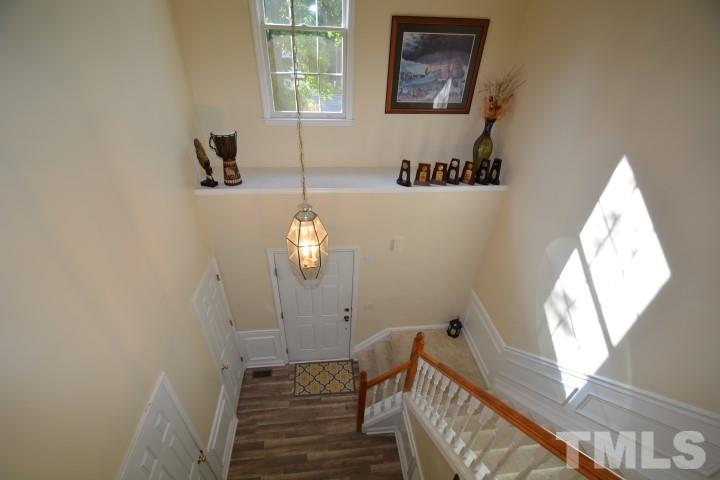 6208 Brielson Place Raleigh, NC 27616 - Photo 9 of 18 a view of a bedroom with wooden floor and windows