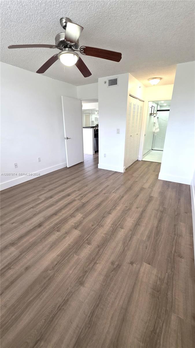 12136 St.Andrews Place, Unit 108 Miramar, FL 33025 - Photo 11 of 43 a view of empty room with wooden floor