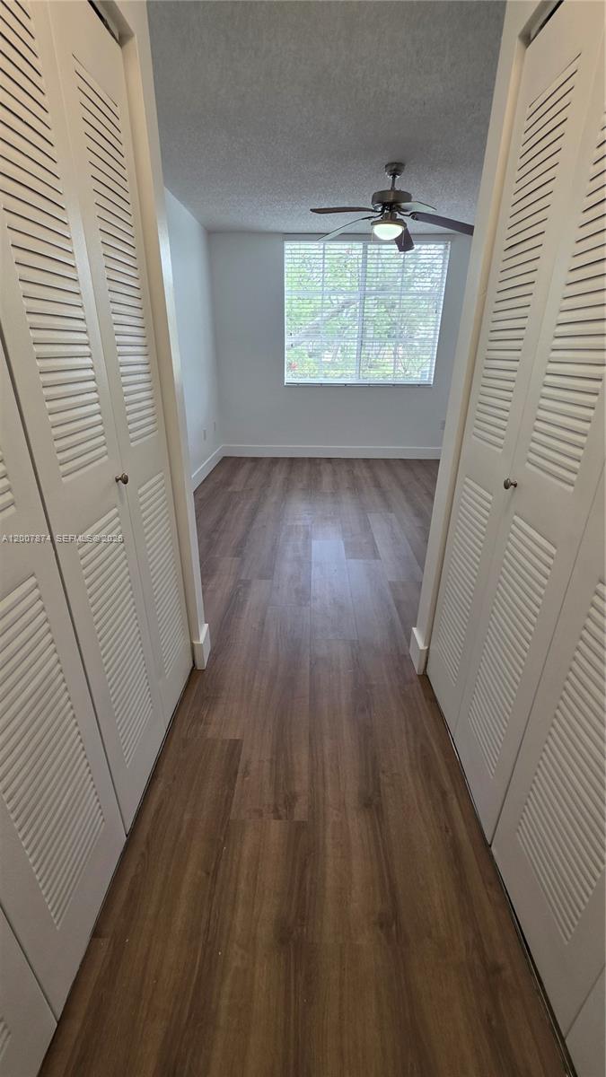 12136 St.Andrews Place, Unit 108 Miramar, FL 33025 - Photo 17 of 43 an empty room with wooden floor and windows