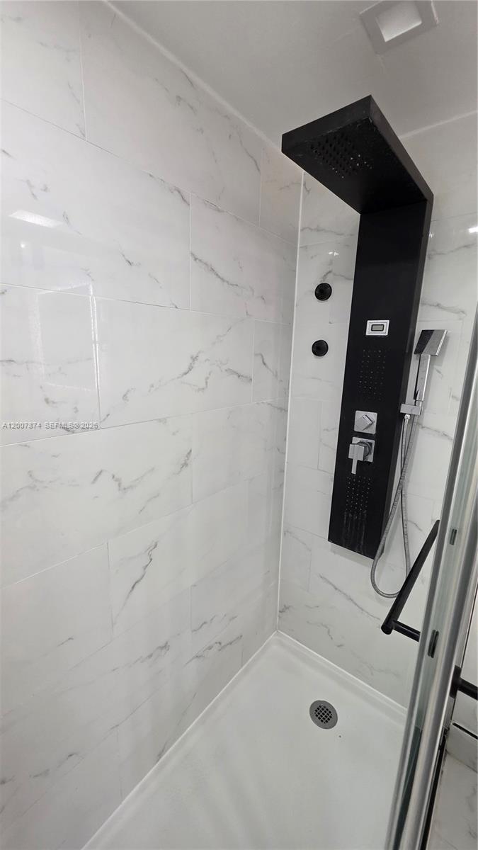 12136 St.Andrews Place, Unit 108 Miramar, FL 33025 - Photo 26 of 43 a bathroom with a sink and a shower