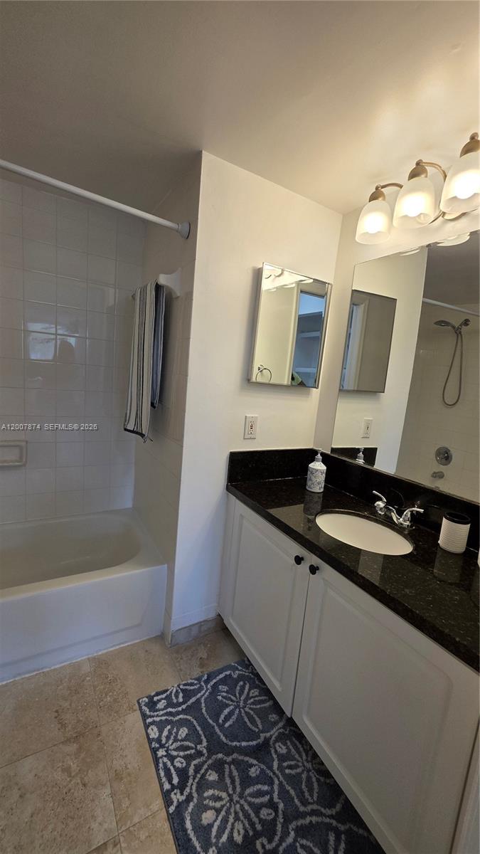 12136 St.Andrews Place, Unit 108 Miramar, FL 33025 - Photo 28 of 43 a bathroom with a sink and a mirror