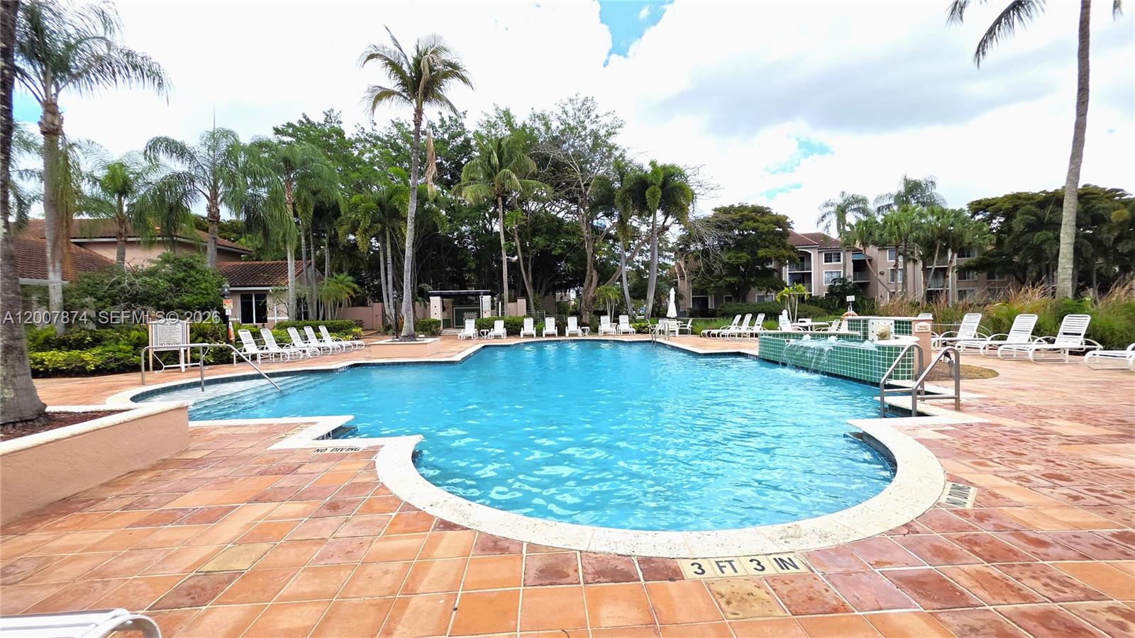 12136 St.Andrews Place, Unit 108 Miramar, FL 33025 - Photo 30 of 43 a swimming pool with outdoor seating and yard
