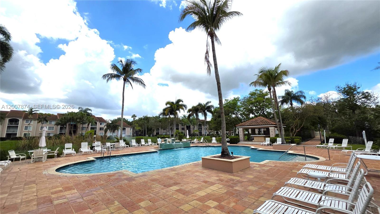 12136 St.Andrews Place, Unit 108 Miramar, FL 33025 - Photo 31 of 43 a view of a house with swimming pool and sitting area