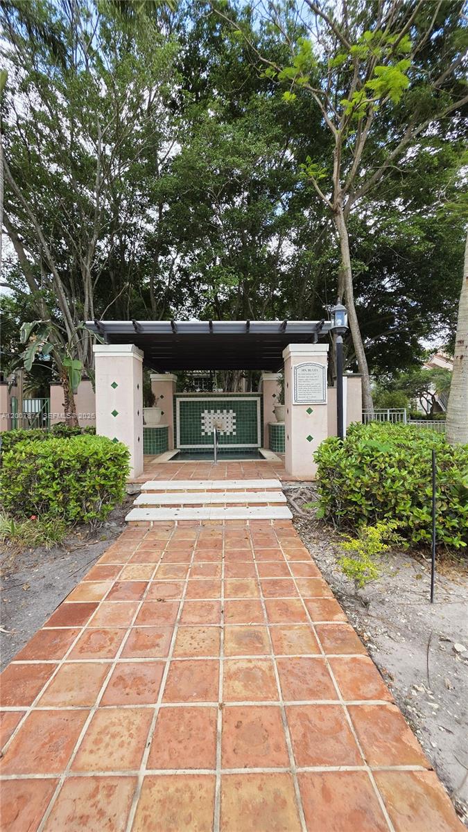 12136 St.Andrews Place, Unit 108 Miramar, FL 33025 - Photo 37 of 43 a house with trees in front of it
