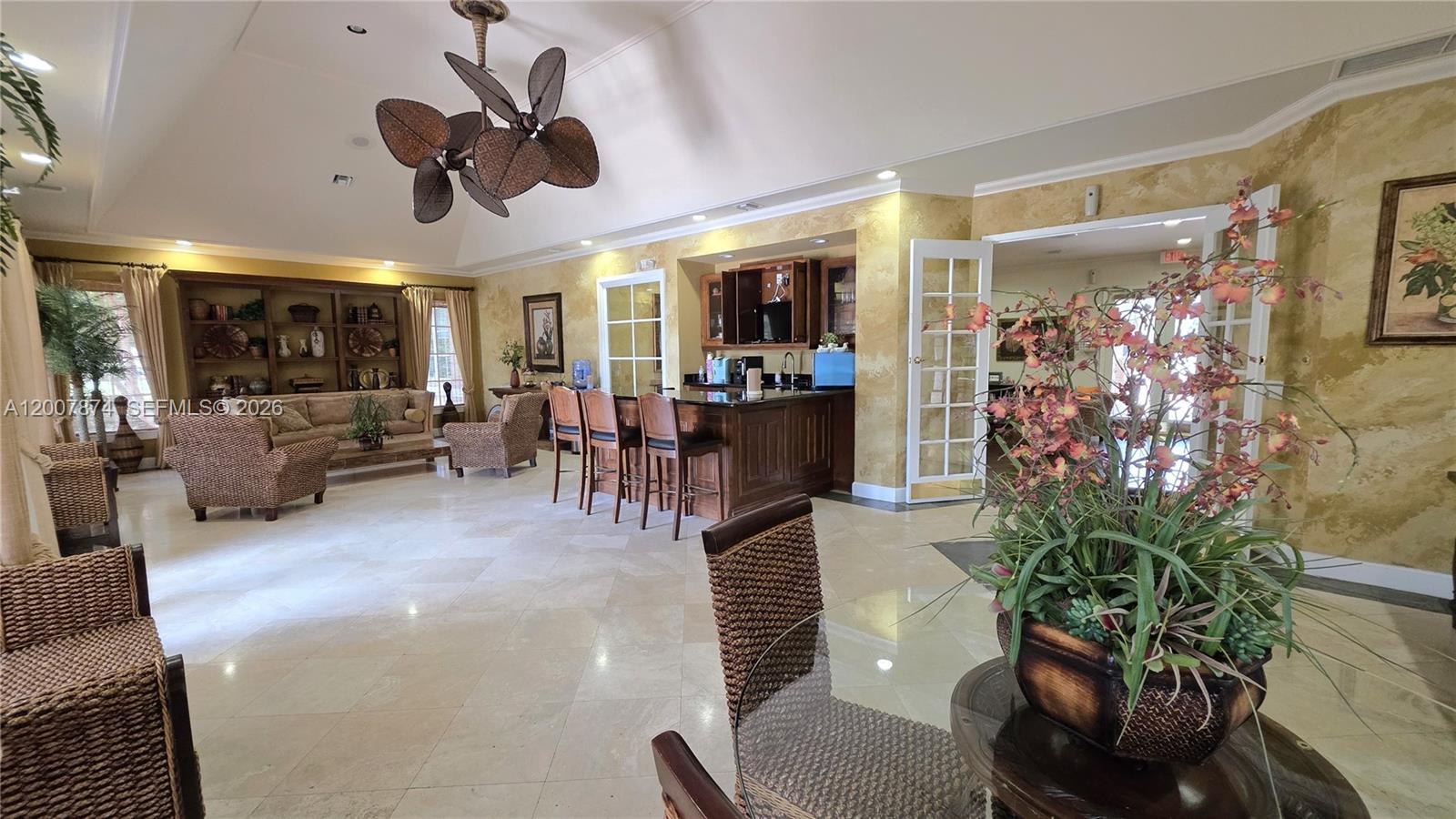 12136 St.Andrews Place, Unit 108 Miramar, FL 33025 - Photo 39 of 43 a living room with furniture and a potted plant