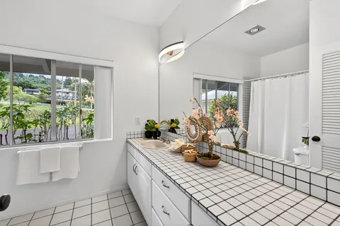 a kitchen with a sink and a large window