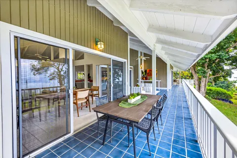 a view of a patio with a table and chairs
