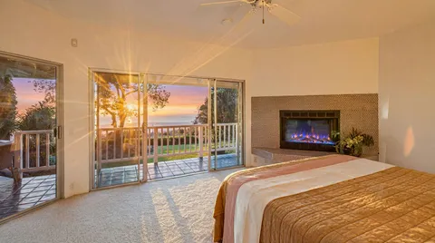 a bedroom with a bed and a tv