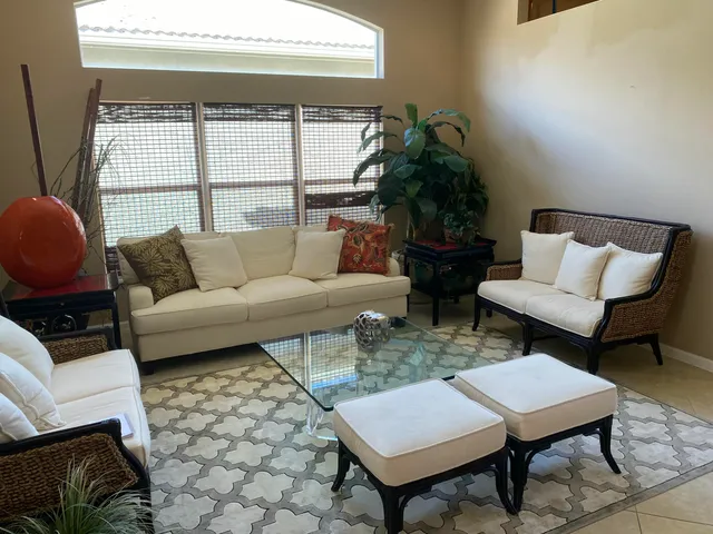 a living room with furniture and a window