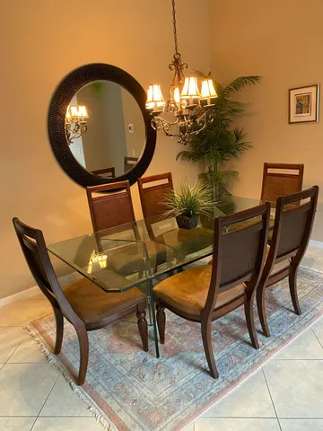 a view of a dining room with furniture and chandelier