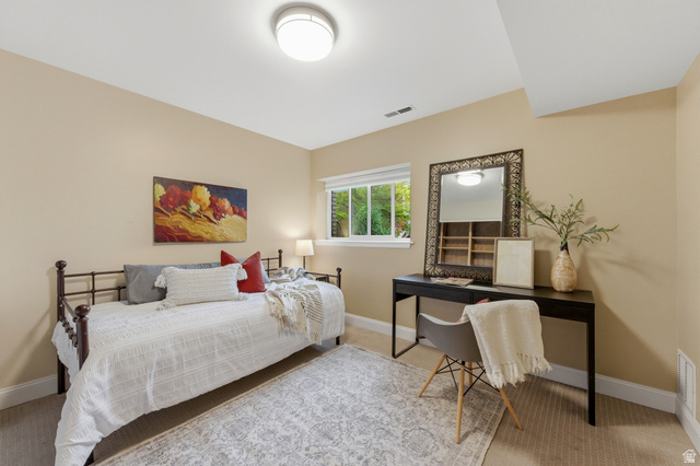 3674 Oak Rim Way Salt Lake City, UT 84109 - Photo 30 of 47 Neutral tone wall paint, carpet flooring, baseboard trim, recessed window, and flush mount lighting