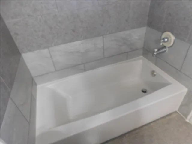 a bathroom with a bathtub