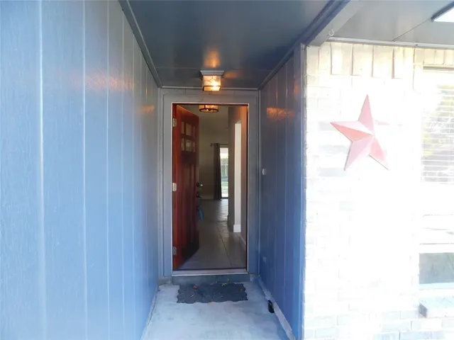 a view of hallway with windows