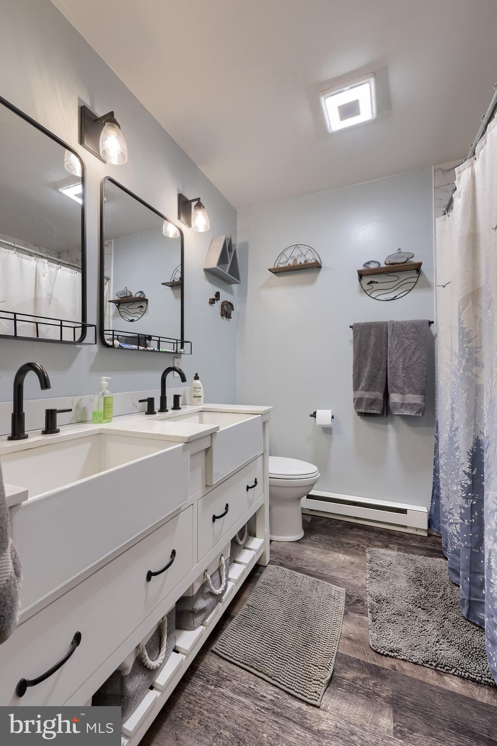 460 Greenville Road Denver, PA 17517 - Photo 17 of 50 a bathroom with a double vanity sink and mirror