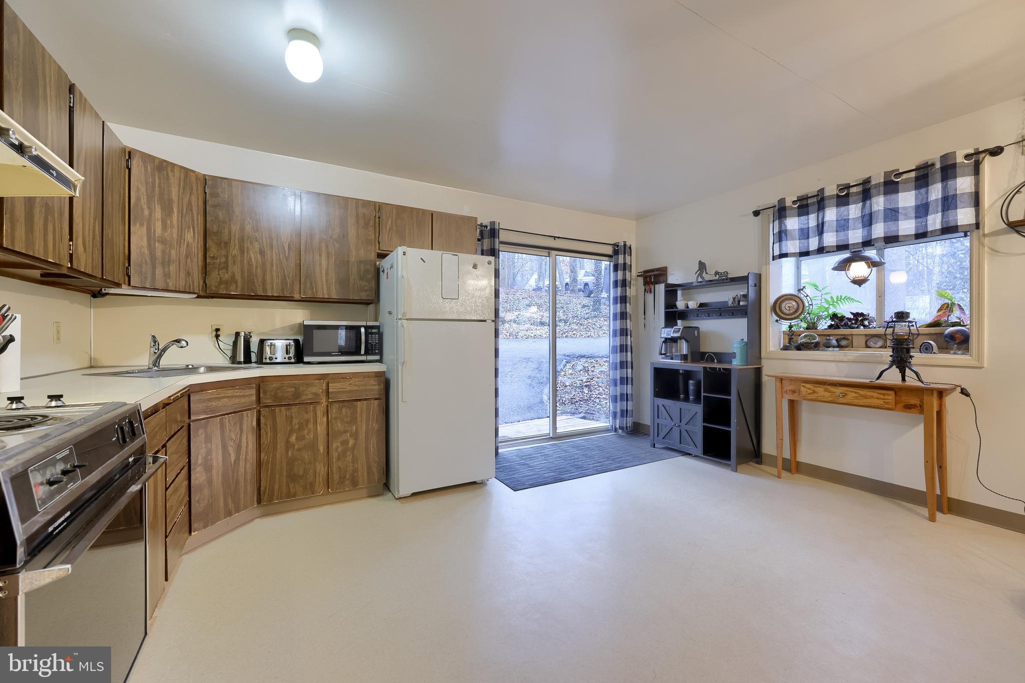 460 Greenville Road Denver, PA 17517 - Photo 4 of 50 a kitchen with refrigerator and cabinets