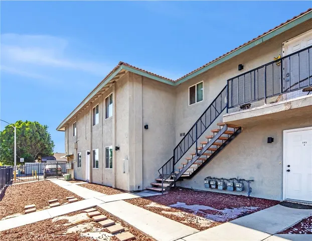 a view of a house with wooden floor and a stairs