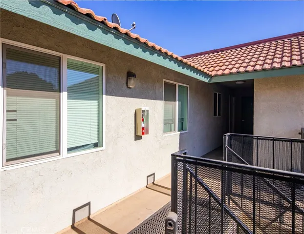 a view of balcony with furniture