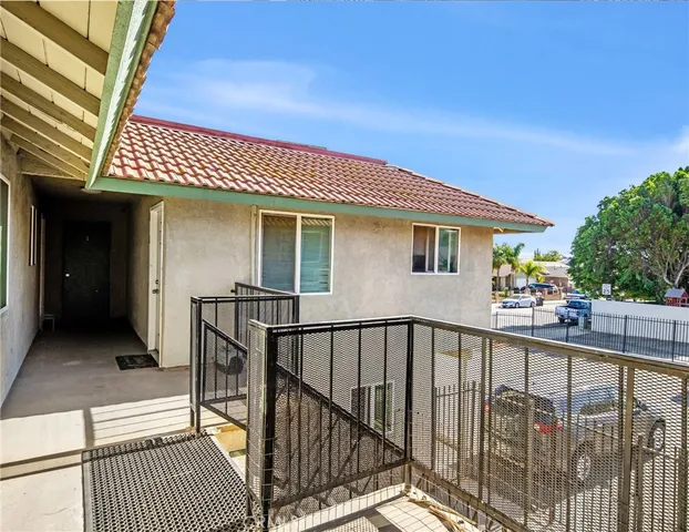 a view of a house with wooden deck