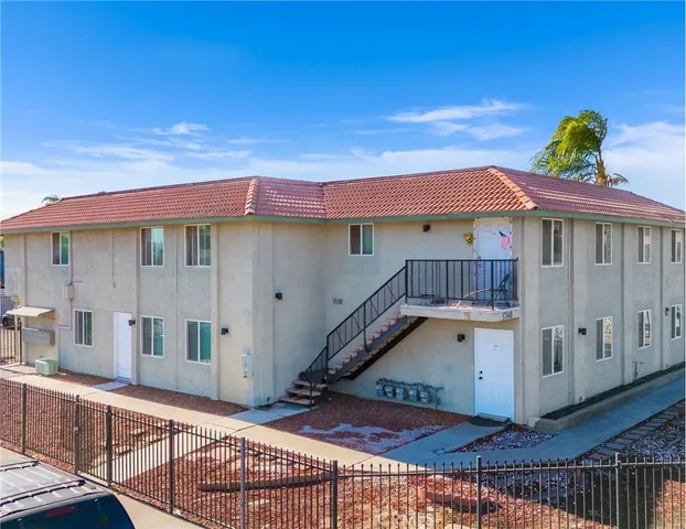 a view of a house with wooden deck