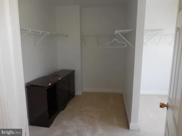 a kitchen with a refrigerator and cabinets