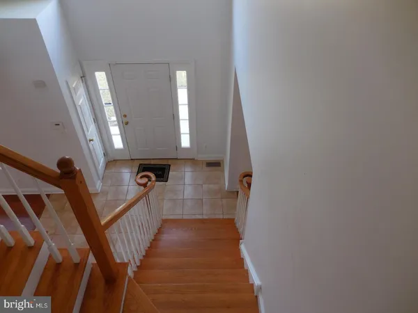 a view of a hallway view with staircase