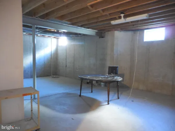 a view of a livingroom with furniture and a table