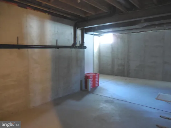 a room with water heater and a wooden door
