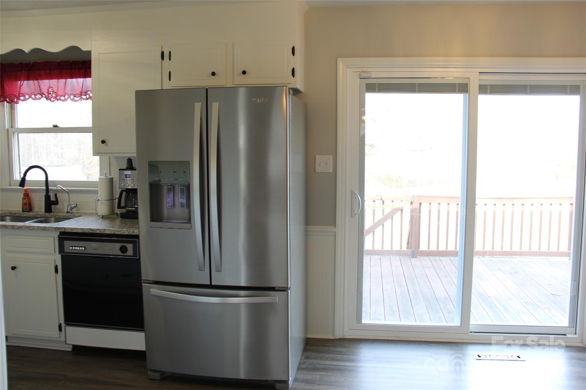 147 Sinclair Road Mooresville, NC 28115 - Photo 11 of 30 a kitchen with stainless steel appliances a refrigerator sink and cabinets