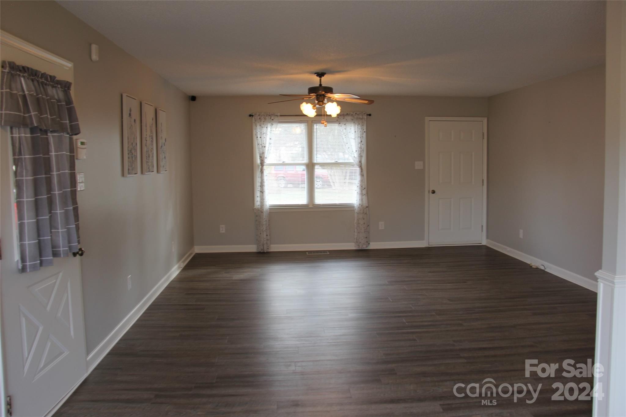 147 Sinclair Road Mooresville, NC 28115 - Photo 17 of 30 wooden floor in an empty room with a window