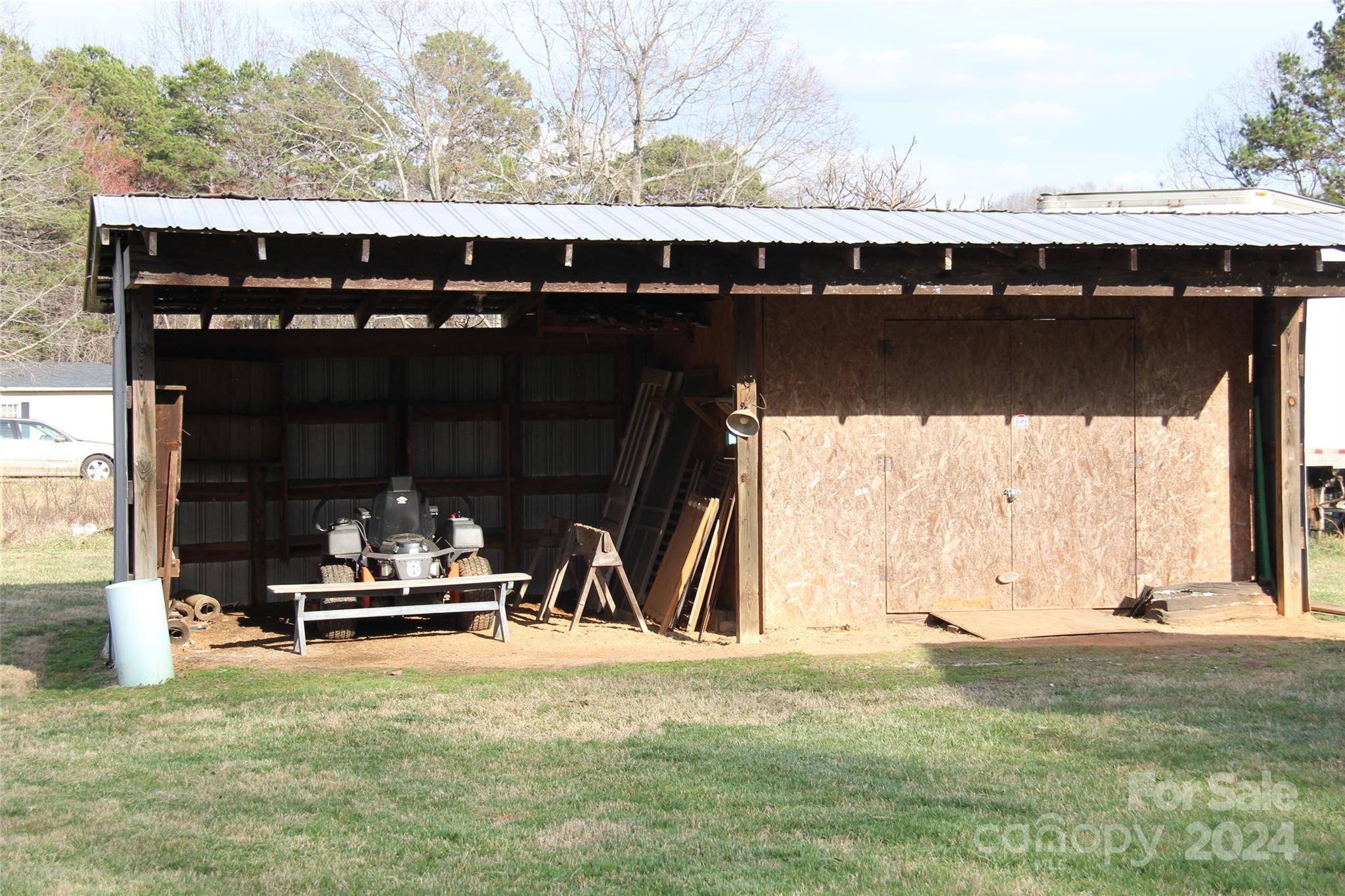 147 Sinclair Road Mooresville, NC 28115 - Photo 20 of 30 a backyard of a house with table and chairs