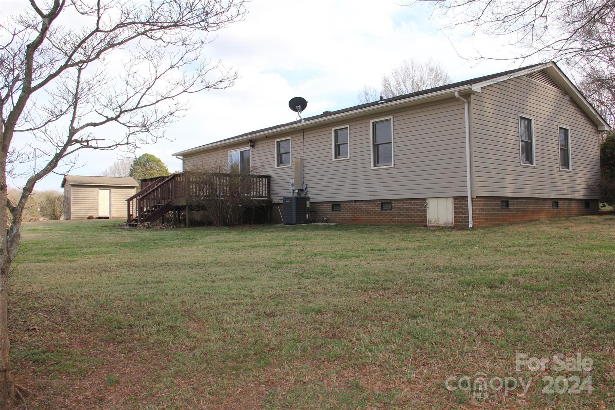 147 Sinclair Road Mooresville, NC 28115 - Photo 25 of 30 a view of a house with a yard