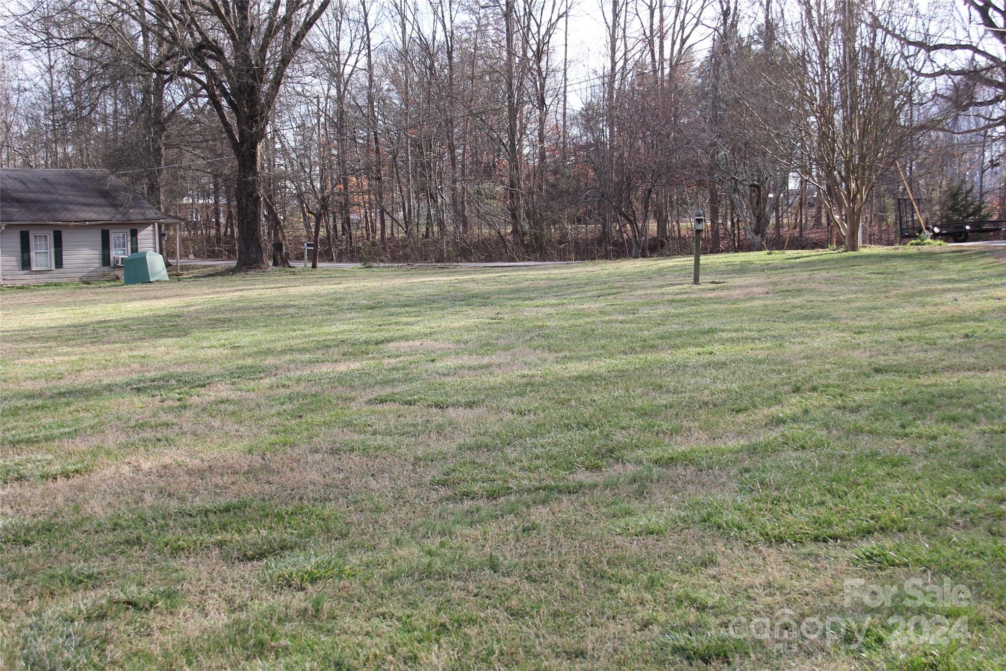 147 Sinclair Road Mooresville, NC 28115 - Photo 28 of 30 a backyard of a house with lots of green space