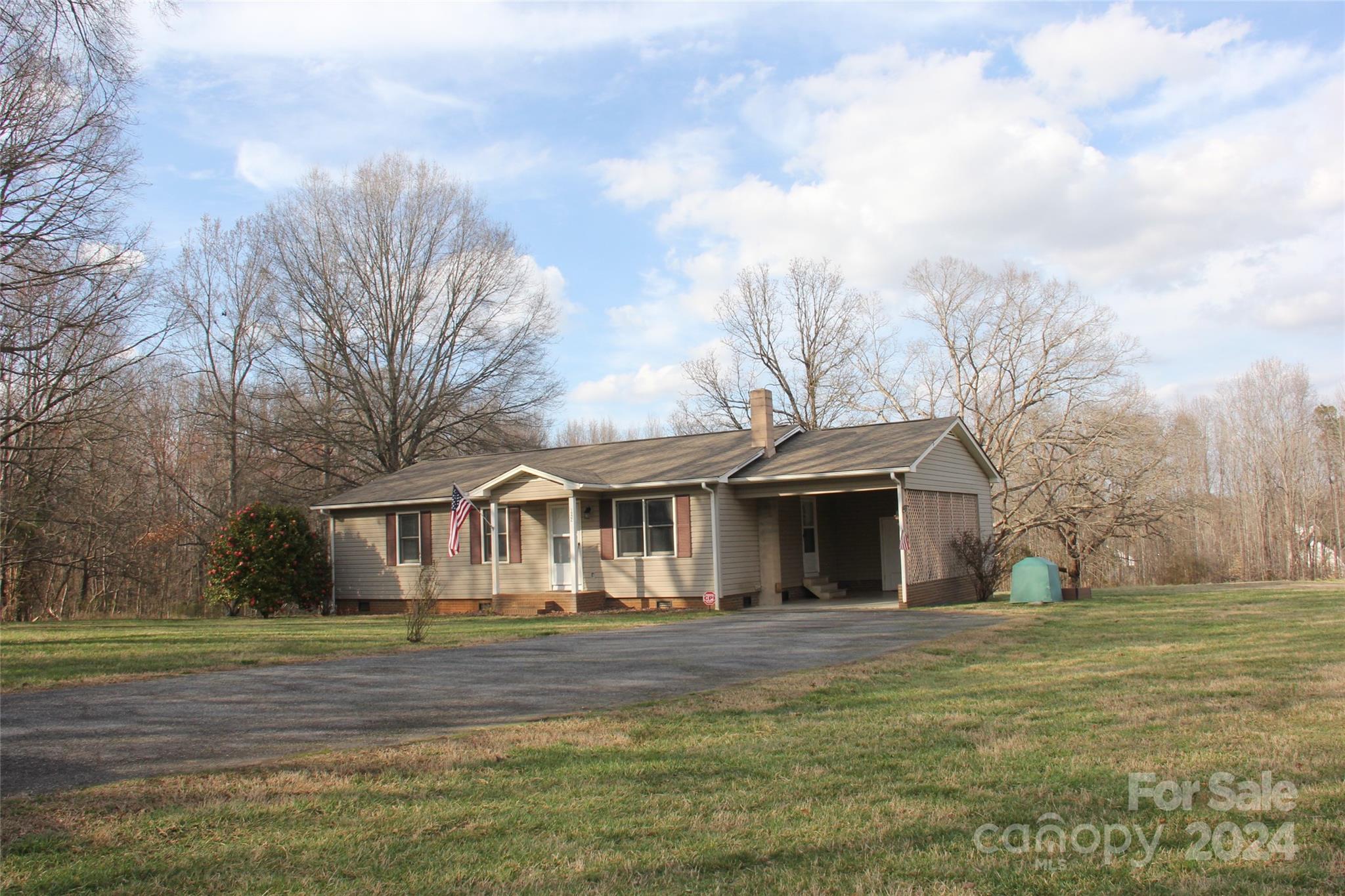 147 Sinclair Road Mooresville, NC 28115 - Photo 5 of 30 a front view of a house with a garden