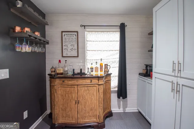 a kitchen with stainless steel appliances granite countertop a refrigerator and a stove