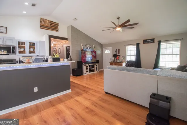 a living room with furniture and a flat screen tv