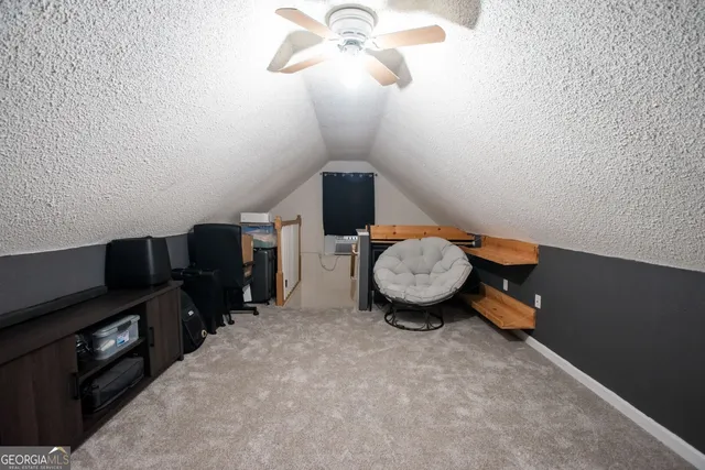 a view of a workspace with furniture