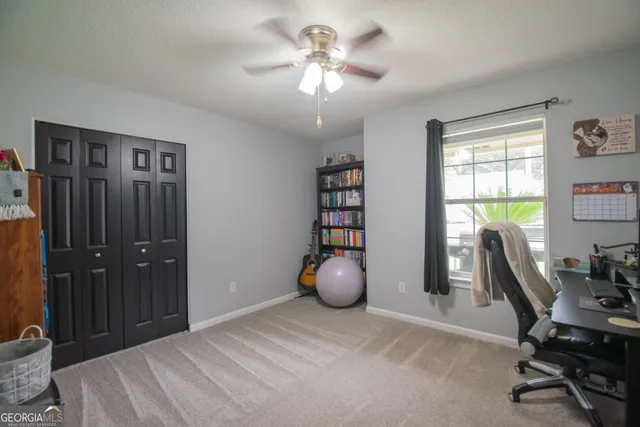 a bedroom with a workspace