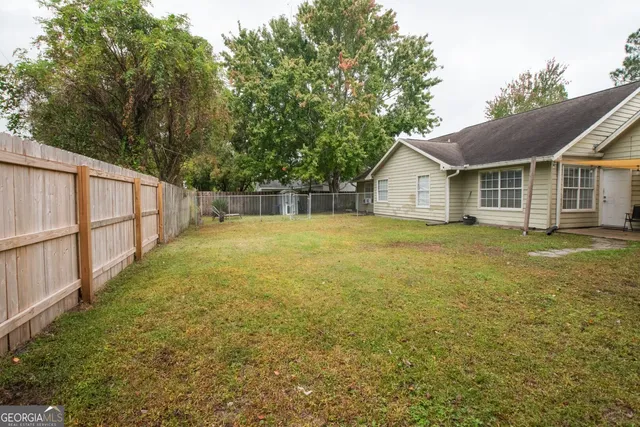 a view of a house with a garden