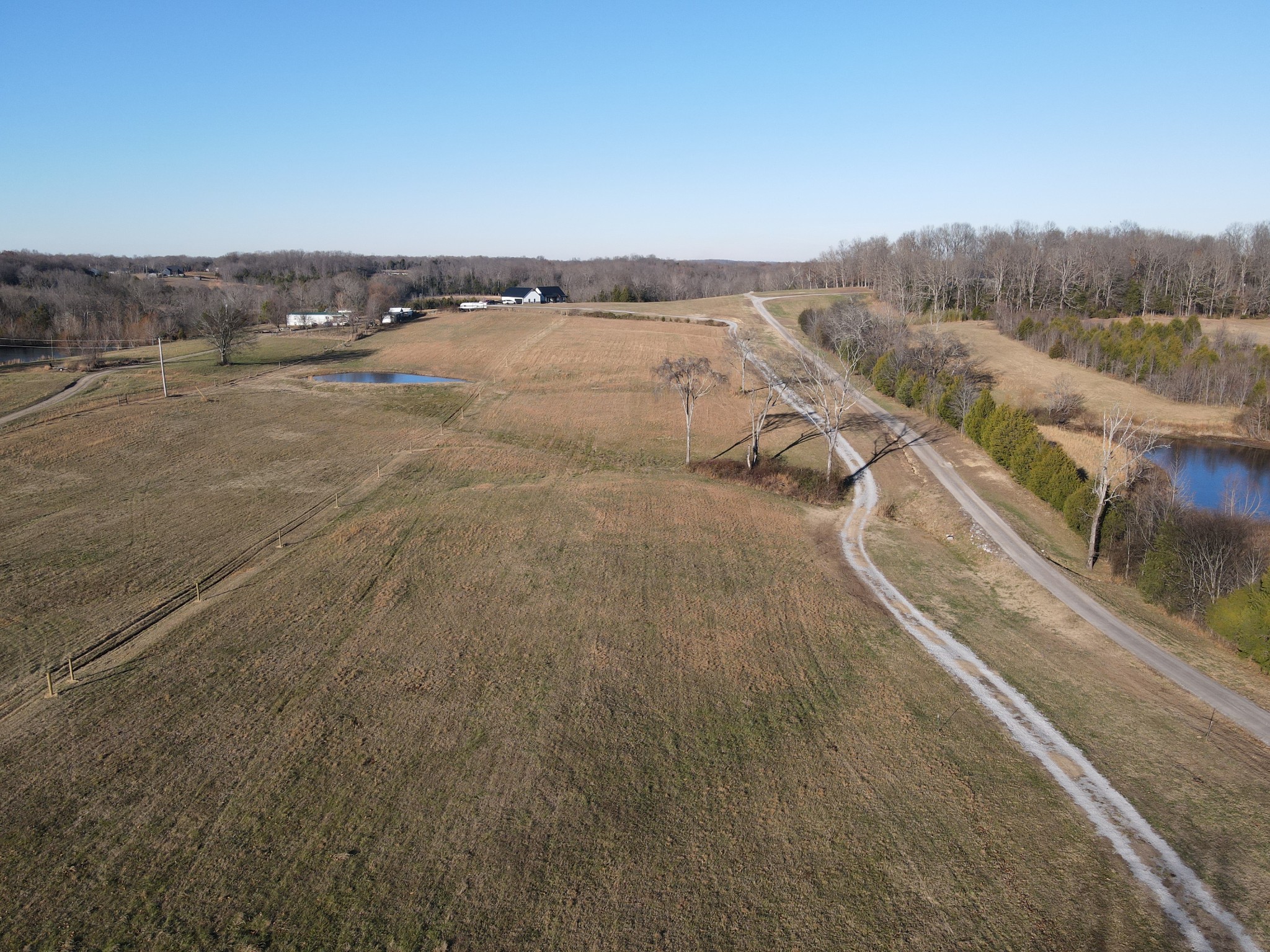 374 Buck Graves Road Westmoreland, TN 37186 - Photo 2 of 10 an aerial view of residential houses with outdoor space and trees
