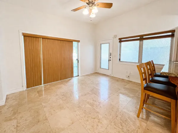 a view of work space with furniture and a window