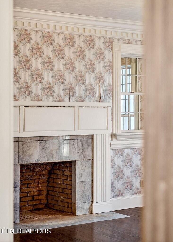 6211 Rocky Point Road Cookeville, TN 38506 - Photo 22 of 59 a living room with a fireplace and a window