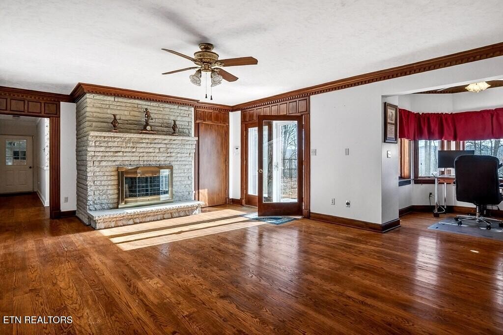 6211 Rocky Point Road Cookeville, TN 38506 - Photo 25 of 59 a view of an empty room with a fireplace and a window