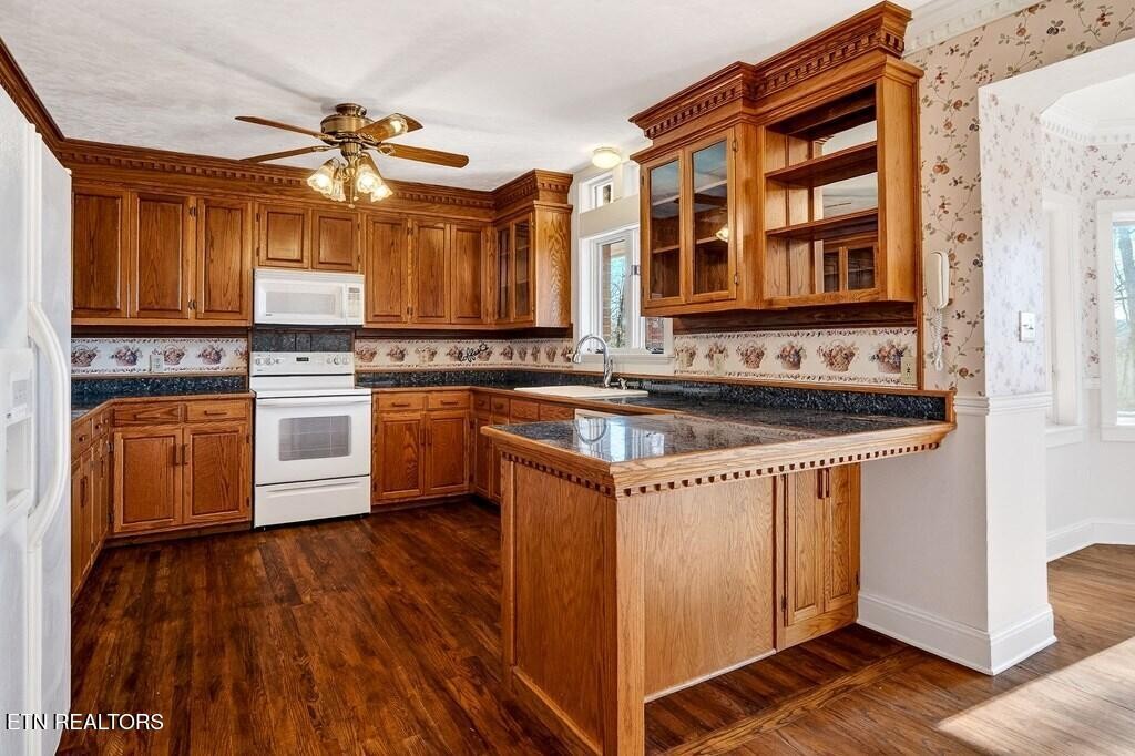 6211 Rocky Point Road Cookeville, TN 38506 - Photo 29 of 59 a kitchen with stainless steel appliances granite countertop a stove and a sink